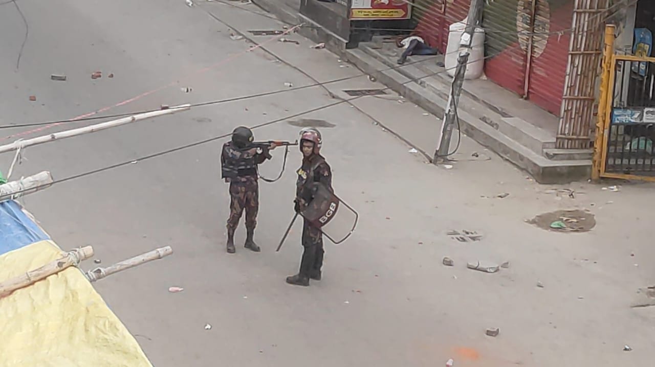 A man lies motionless on the pavement in Banasree G Block after the shooting.